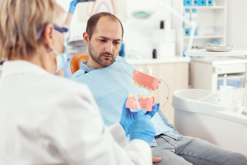 Dentist reviewing a personalized dental implant treatment plan and cost estimate with a patient during a consultation.